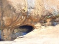 Deep cave on a huge stone