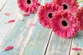 Deep color bouquet from beautiful gerbera daisy flowers on vintage wooden background. Greeting card for mother or womans day.