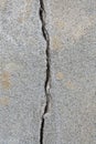 Deep crack in an old brick wall with damaged plaster Royalty Free Stock Photo