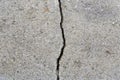 Deep crack in an old brick wall with damaged plaster Royalty Free Stock Photo