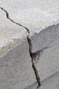 Deep crack in an old brick wall with damaged plaster Royalty Free Stock Photo