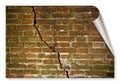 Deep crack in old damaged damp brick wall - concept image with copy space - curl and shadow design concept image