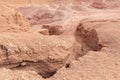 Deep crack in the rock leading down to a Hidden Lake near the Timna park,surrounded by mountains near Eilat city, Arava Valley, Royalty Free Stock Photo