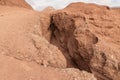 Deep crack in the rock leading down to a Hidden Lake near the Timna park,surrounded by mountains near Eilat city, Arava Valley, Royalty Free Stock Photo