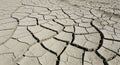Deep cracks split across dry parched earth forming an intricate pattern of broken soil with rough textures showing the effects of Royalty Free Stock Photo
