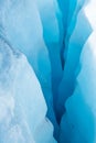 Looking down into multi layered crevasse of blue ice in the Salmon Glacier, Canada Royalty Free Stock Photo