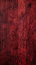 Deep crimson red wooden surface with intricate grain patterns and a smooth, polished finish, exuding warmth and luxury.