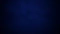 Deep, dark navy blue abstract background with subtle texture and soft gradient lighting Keywords: dark blue, navy Royalty Free Stock Photo