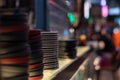 Deep dishes stacked in piles on a kitchen counter in a fast food restaurant. Kitchen objects on a blurred background