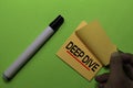 Deep Dive write on sticky notes. Isolated on green table background