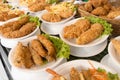 Deep fat fried food in plates on cafe shop shelf Royalty Free Stock Photo