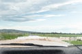 Deep floodwater rushing across a blocked road on a rural road car cannot pass Royalty Free Stock Photo