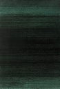 Deep forest green fading into charcoal black with a textured grain overlay for depth.