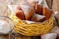 Deep fried African Mandazi donuts with powdered sugar close up o