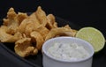 Deep fried anchovies with tartar sauce and lime wedge Royalty Free Stock Photo