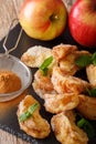 Deep-fried apples with cinnamon and sugar close-up. vertical Royalty Free Stock Photo