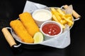 Deep Fried Baked Fish with French Fries Tomato. Royalty Free Stock Photo