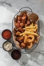 deep-fried beer snacks in a metal basket with craft paper Royalty Free Stock Photo