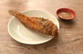 deep fried blacktip grouper fish dipping Thai spicy seafood sauce on plate