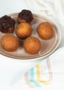 Deep fried bunuelos balls. Creative minimalist composition on a white background Royalty Free Stock Photo