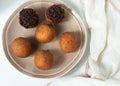 Deep fried bunuelos balls. Creative minimalist composition on a white background Royalty Free Stock Photo