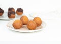 Deep fried bunuelos balls. Creative minimalist composition on a white background Royalty Free Stock Photo