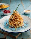 deep fried calamari onion squid with dip isolated on table side view Royalty Free Stock Photo
