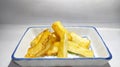 Deep fried cassava root . Brazilian Mandioca Frita (deep fried cassava manioc yuca). Feijoada side dish.