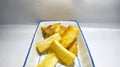 Deep fried cassava root . Brazilian Mandioca Frita (deep fried cassava manioc yuca). Feijoada side dish.