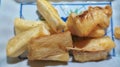 Deep fried cassava root . Brazilian Mandioca Frita (deep fried cassava manioc yuca). Feijoada side dish.