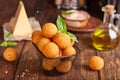 Deep fried Cheese balls. Freshly baked croquettes, served with basil leafs and sauce. Royalty Free Stock Photo