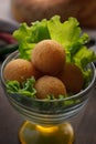 Deep fried Cheese balls, homemade apetizer with lettuce leaves