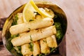 Deep fried Cheese spring roll served in dish isolated on background top view of hot mezza Royalty Free Stock Photo