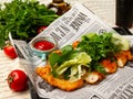 Makhachkala, Dagestan, RUS, May 17, 2019 Sliced fried chicken breast garnished with chopped herbs, lettuce and spinach on a Royalty Free Stock Photo