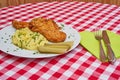 Deep fried chicken escalope or schnitzel with mashed potatoes.