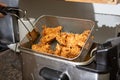 deep fried chicken in fryer machine Royalty Free Stock Photo