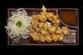 Thai snack, deep Fried chicken tendon in black background Royalty Free Stock Photo