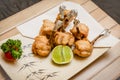 deep fried chicken wing tulips  with salt and lime on wooden background , stock photo Royalty Free Stock Photo