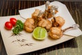 deep fried chicken wing tulips  with salt and lime on wooden background , stock photo Royalty Free Stock Photo