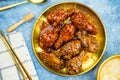 Deep fried chicken wings or barbecue sprinkled with white sesame on golden plate Royalty Free Stock Photo