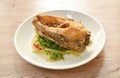 deep fried chop Nile Tilapia or mango fish slice dressing soy sauce and celery on plate Royalty Free Stock Photo