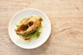 deep fried chop Nile Tilapia or mango fish slice dressing soy sauce and celery on plate Royalty Free Stock Photo