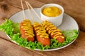 Deep fried corn dogs on wooden background. Top view,