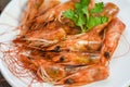 Deep fried crispy shrimp head delicious seasoning spices on plate and wooden table background / cooked shrimps or prawns Seafood Royalty Free Stock Photo