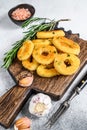 Deep fried crispy squid and onion rings breaded. White background. Top view