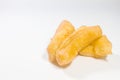Deep-fried dough stick are placed on a white isolated background. Royalty Free Stock Photo