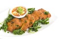 Deep fried fish cake serve with fried basil leaves eat with sweet cucumber sauce