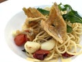 Deep fried fish with garlic and dried chili spaghetti Royalty Free Stock Photo