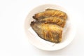 Deep-fried fishes or Snakeskin gourami fish in the round disk on white background with clipping path. The fish is called Pla Salid