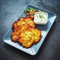 Deep fried German potato fritters with creamy dip Royalty Free Stock Photo